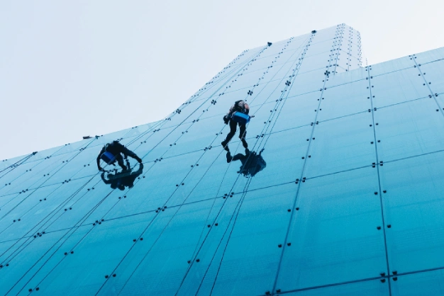 Risky Traditional High-rise Buildings Window Cleaning. Elimante this unsing the ClearBot Robotic Window Cleaning for High-Rises And Tall Buildings